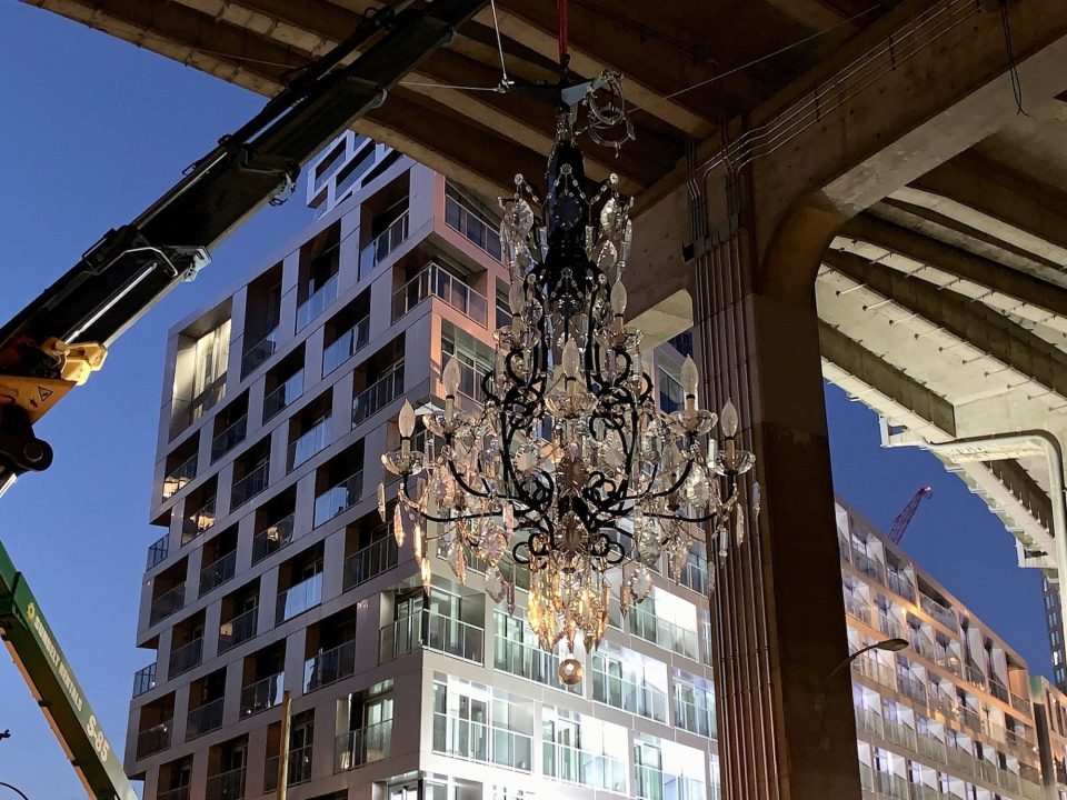 Monumental crystal chandelier installed under Granville Street Bridge